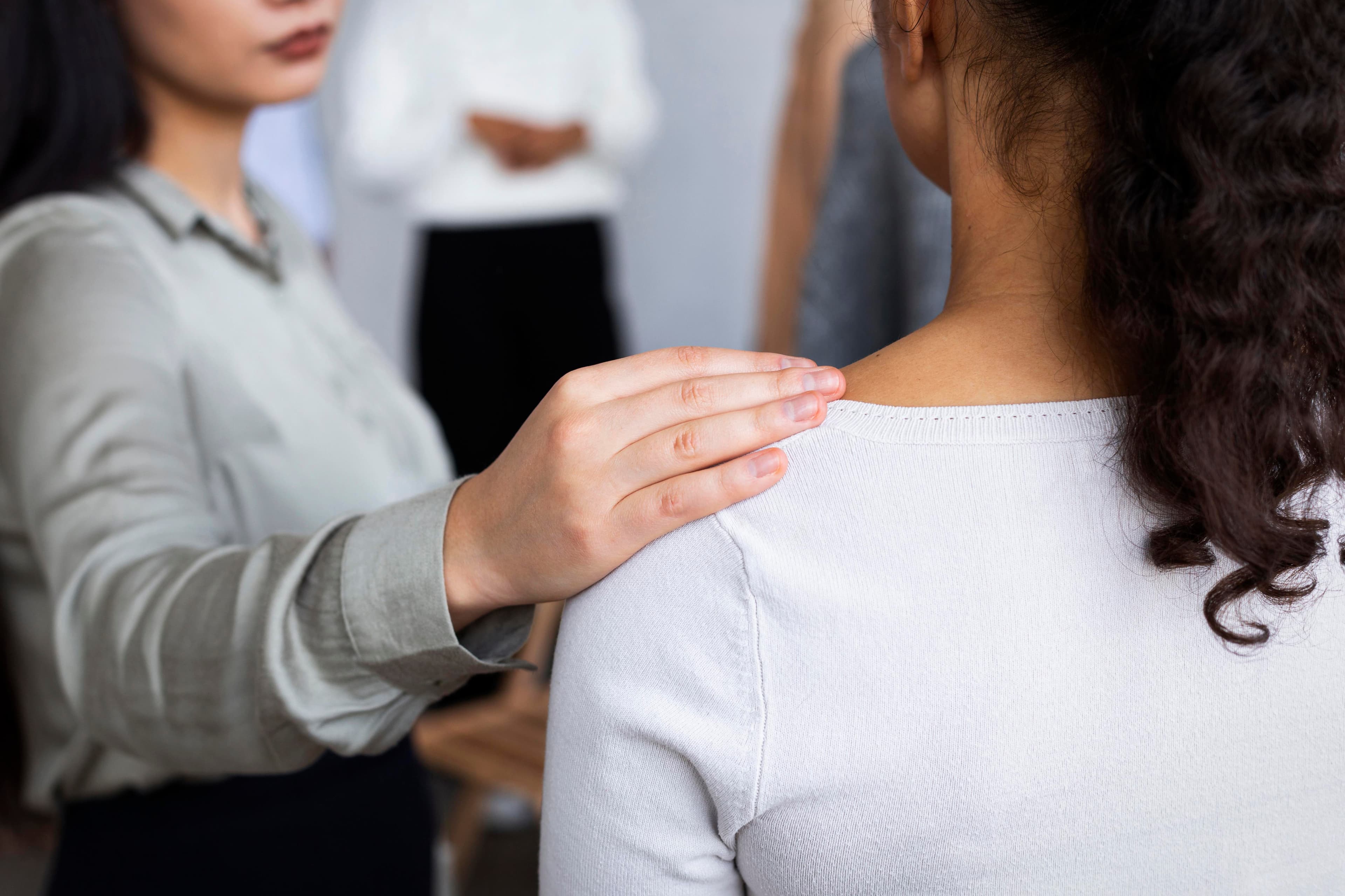 A Woman being consoled during Counseling Session